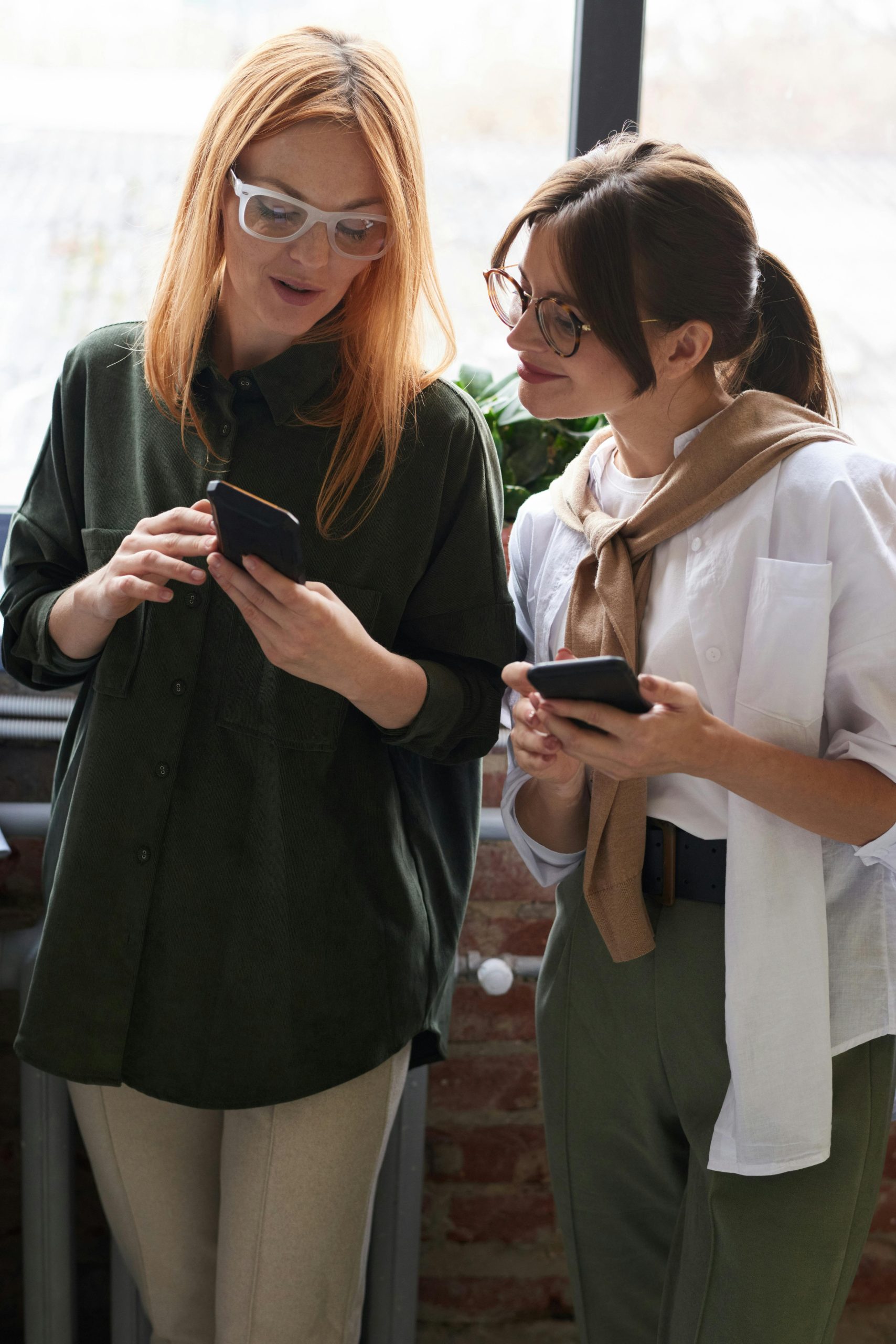 Avoid These 5 Common Mistakes in Your Ad Campaigns (And How to Fix Them) - Women looking down at phones