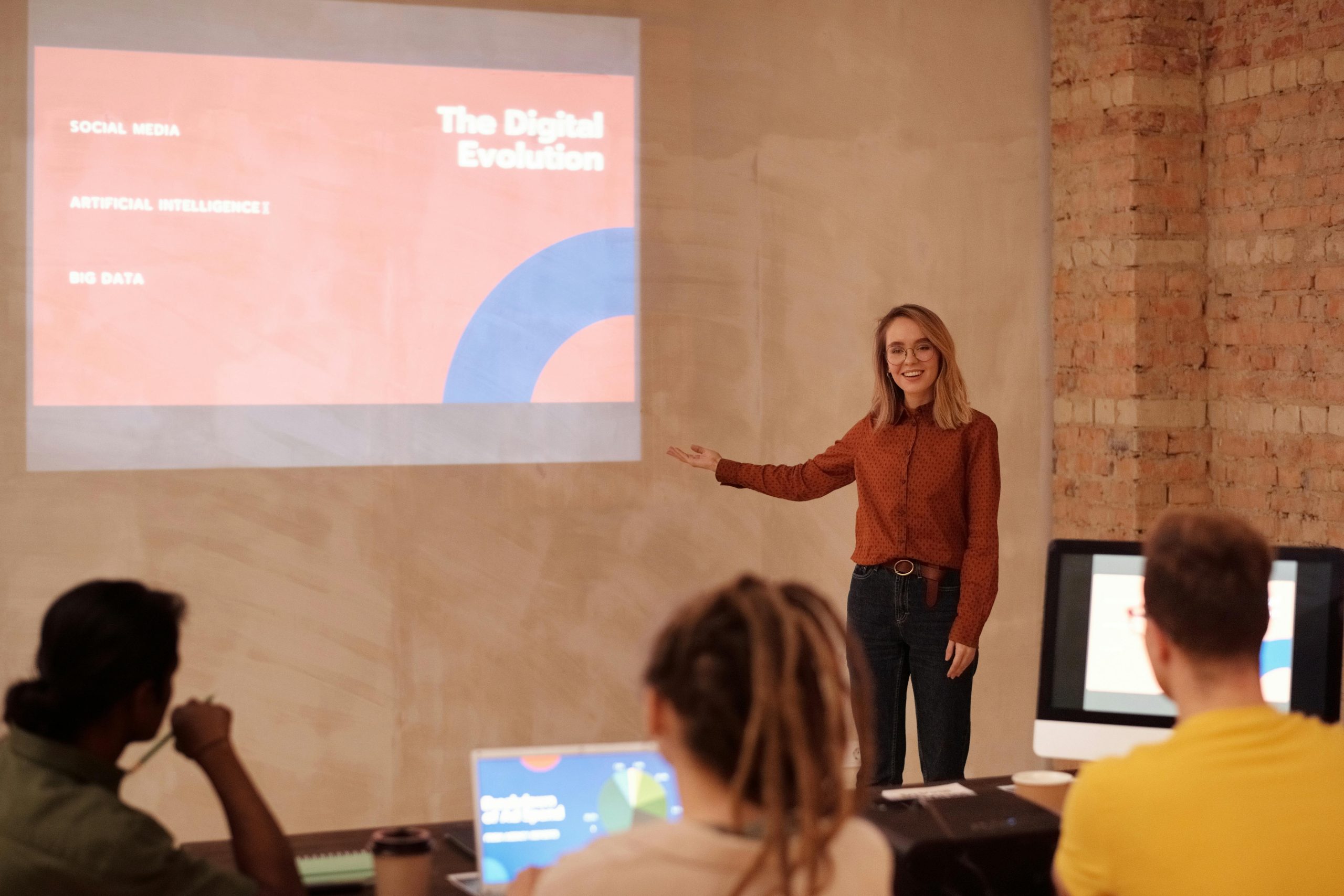 Digital Dawn - Women with Powerpoint Presentation projected onto wall